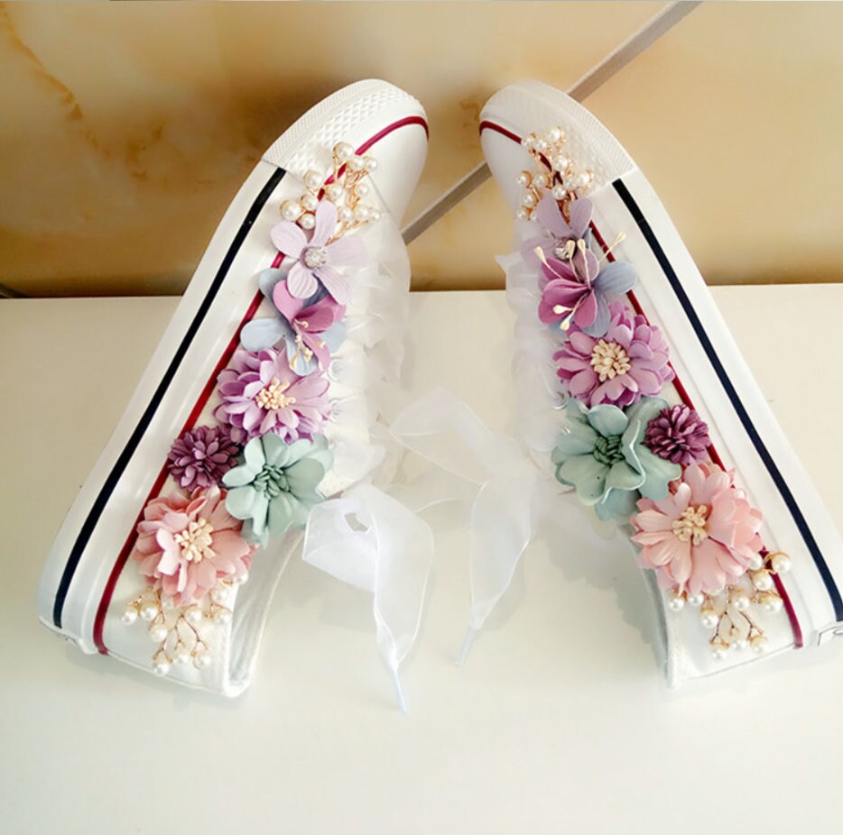 White pumps with sales flowers